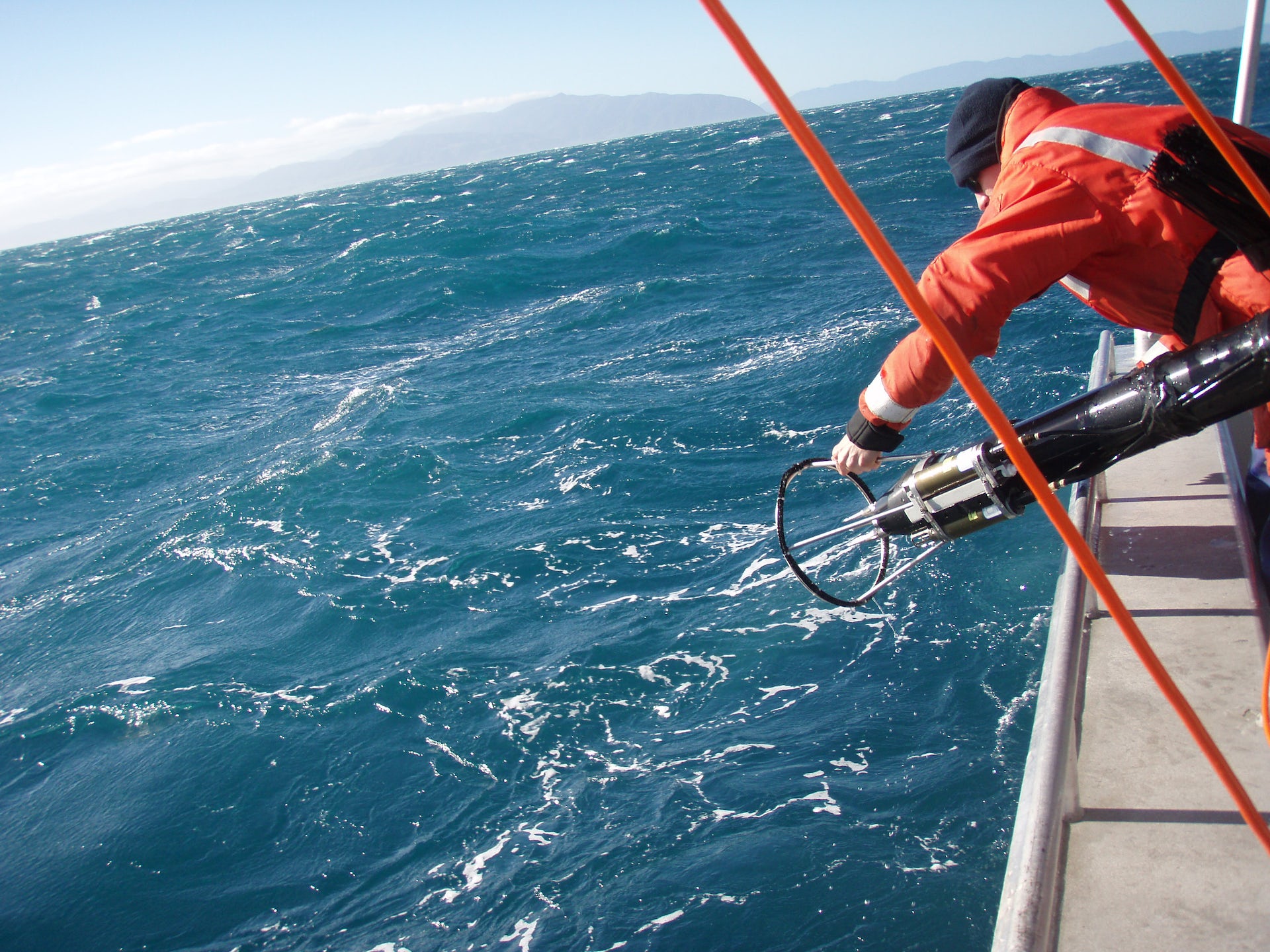 An ocean turbulence sensor being deployed in rough conditions.